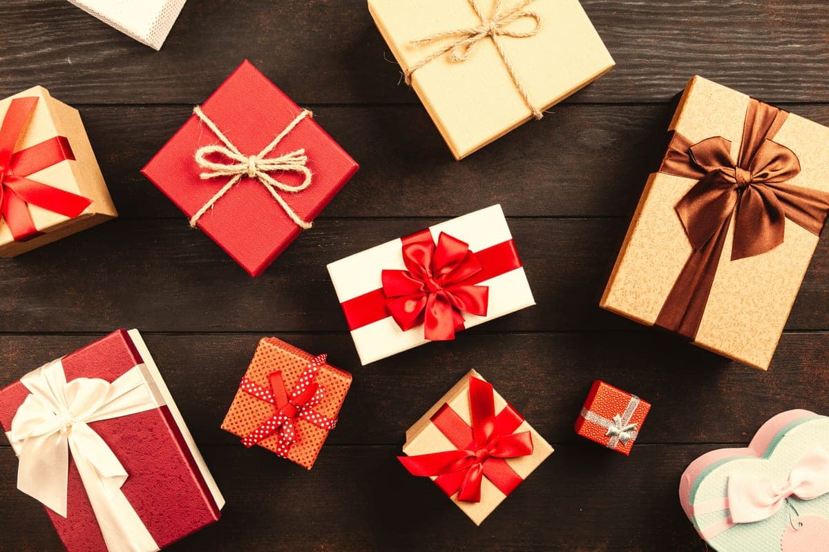 Wrapped gift boxes with ribbon arranged on a table