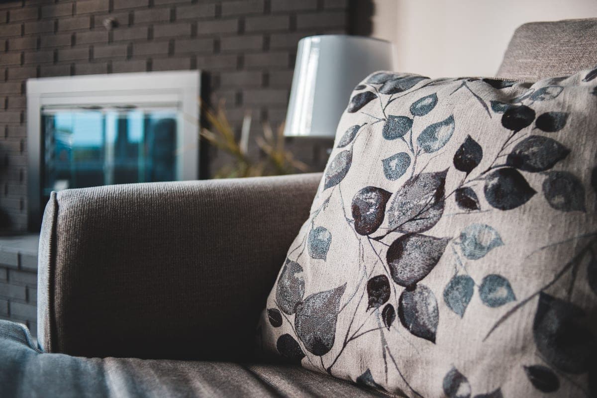 Close view of an upholstered sofa cushion and seam